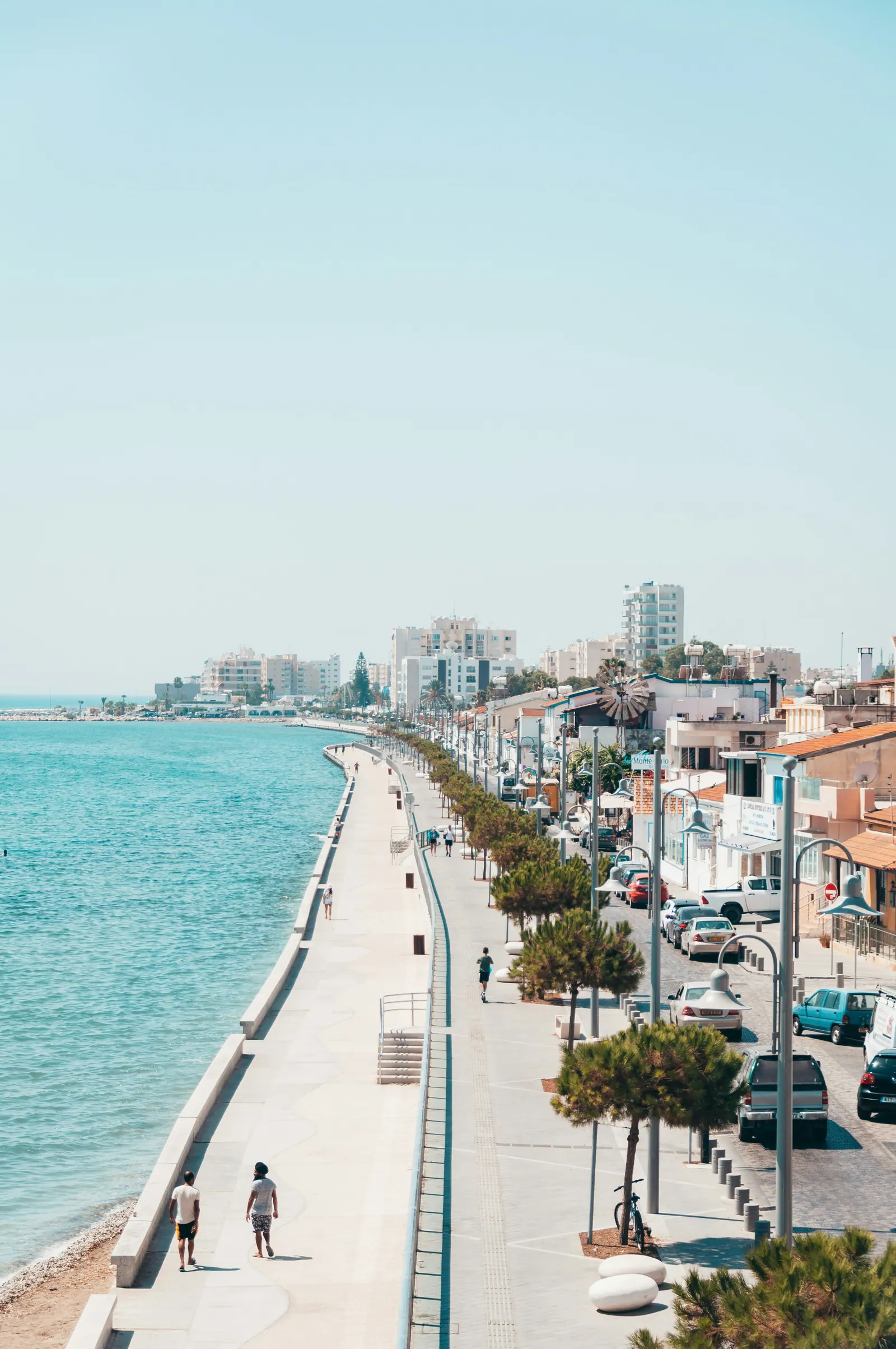 city buildings near body of water during daytime